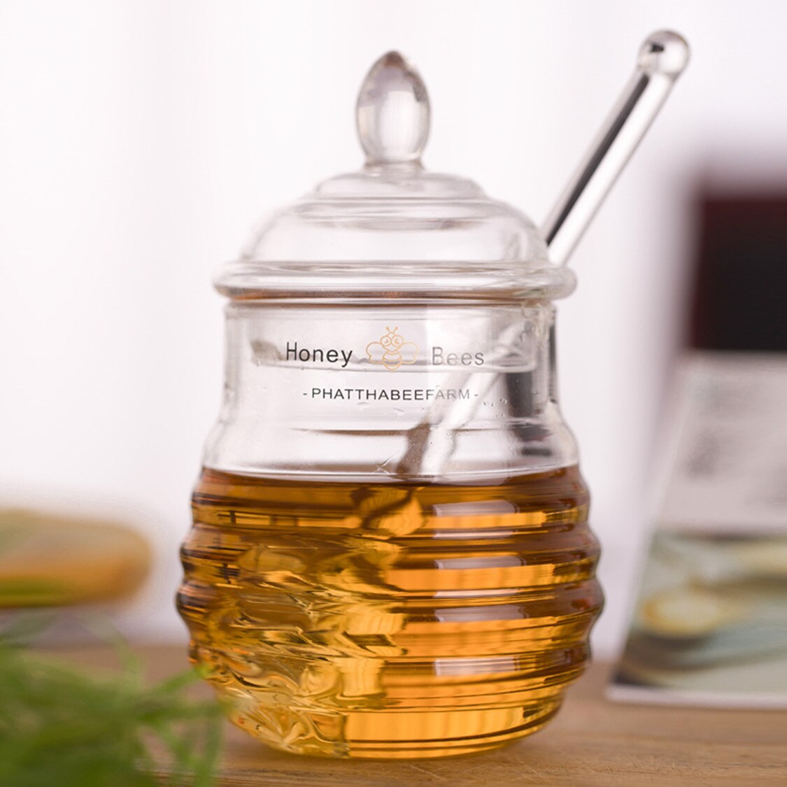 Glass Of Honey With Spoon Towers