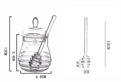 Glass Of Honey With Spoon Towers